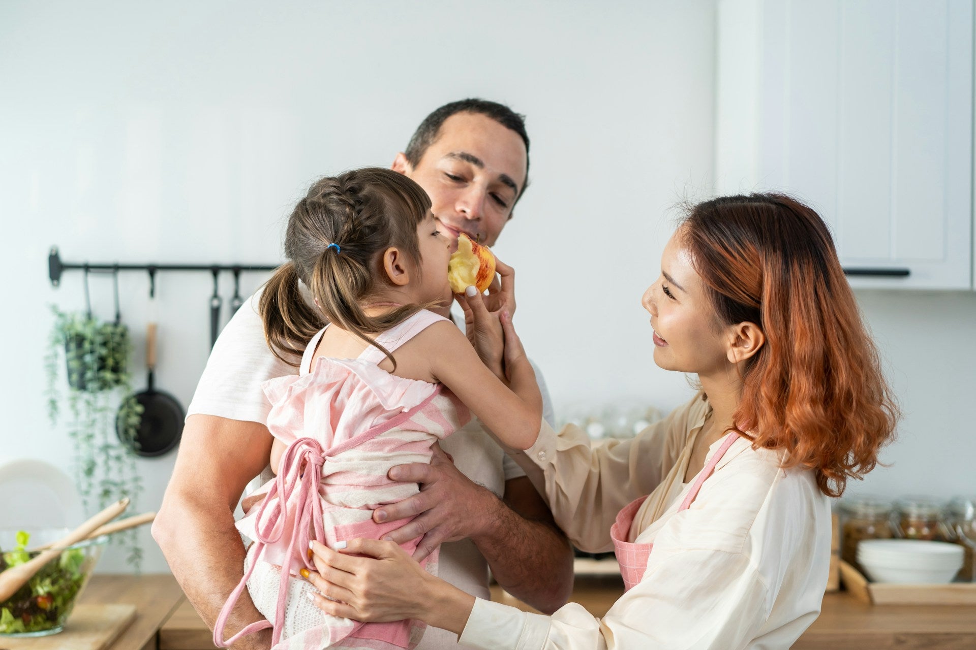 parents feeding child